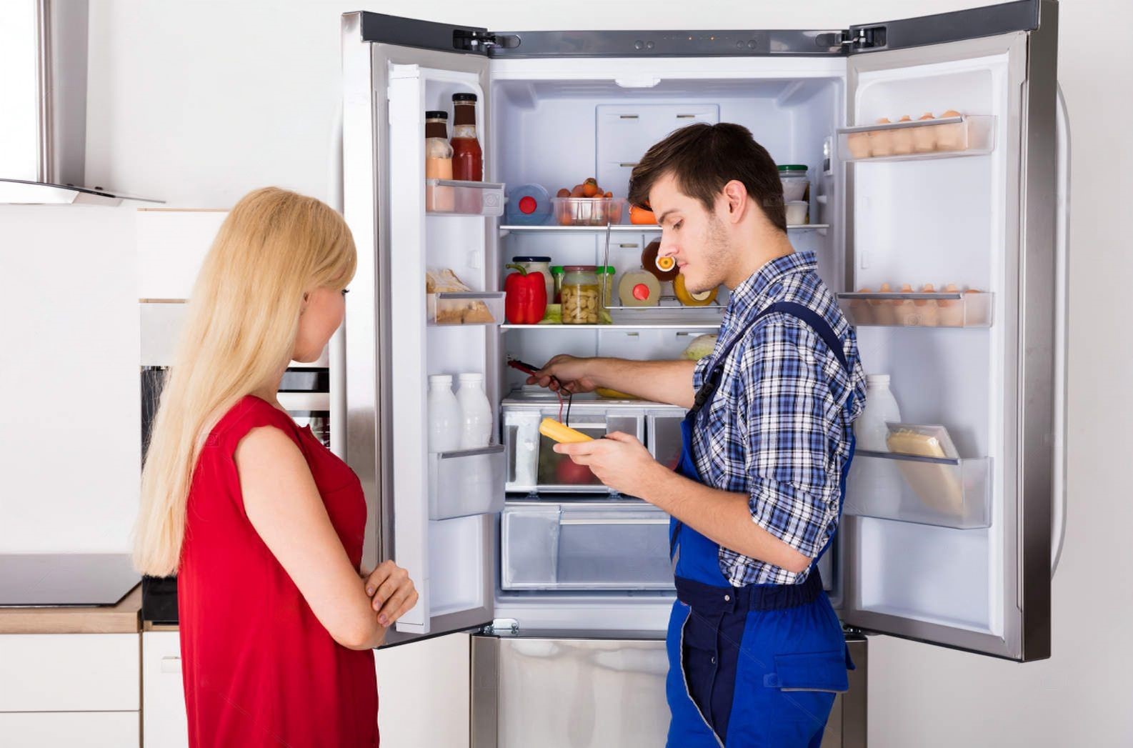 depositphotos_138896276-stock-photo-technician-checking-fridge-transformed